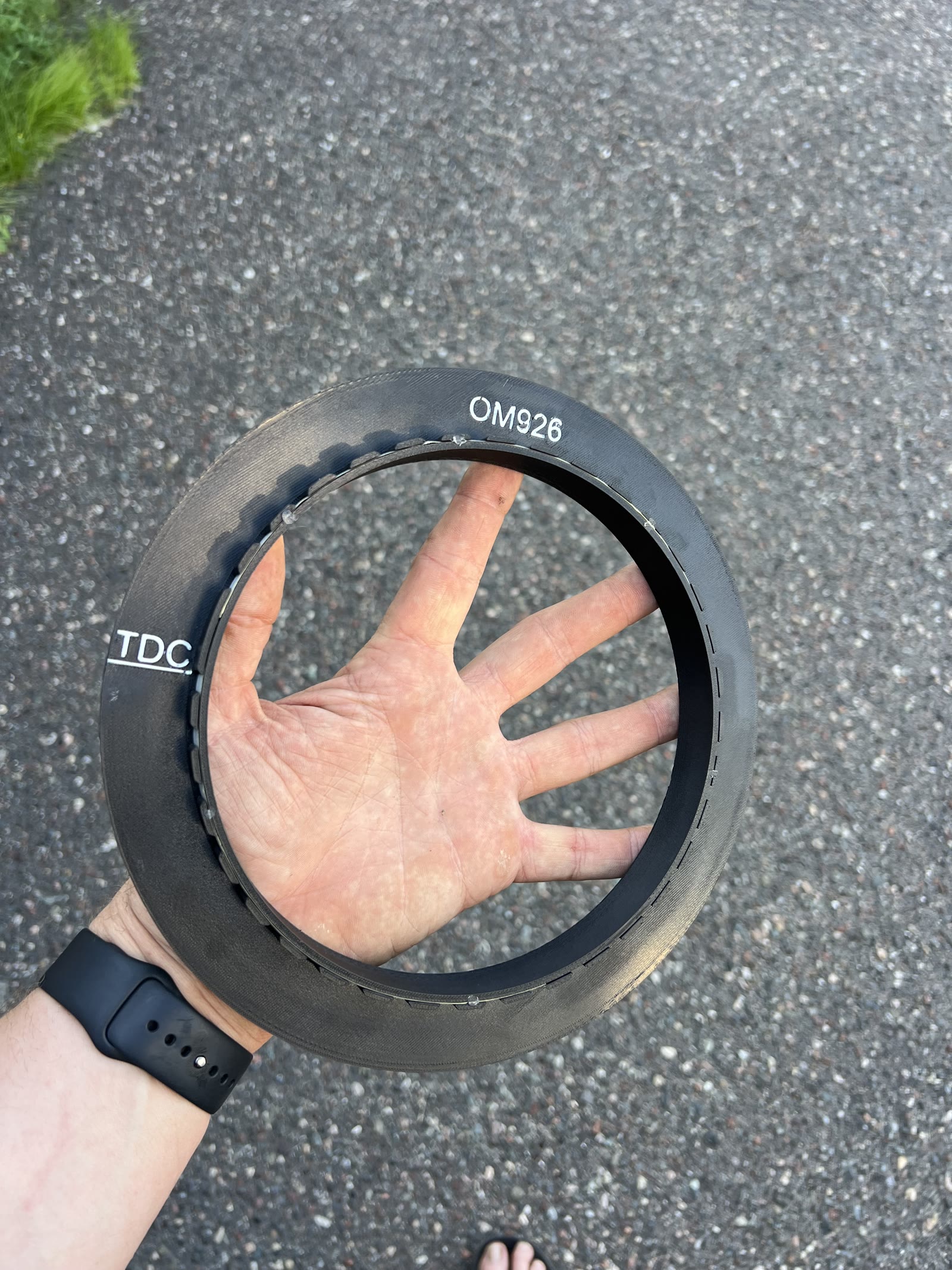 The printed crank pickup target for the OM926 held in one hand, marked at TDC